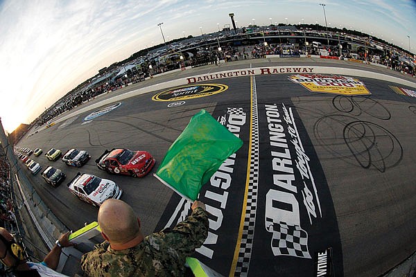 In this May 11, 2012, file photo, drivers take the green flag for the start of the NASCAR Nationwide Series race at Darlington Raceway in Darlington, S.C.