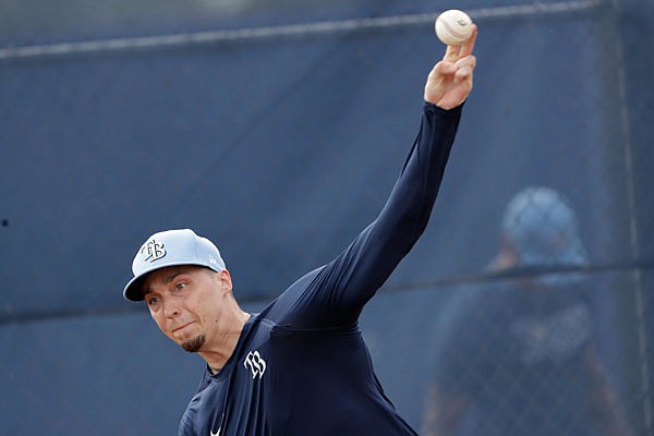 In this Feb. 14 file photo, Rays starting pitcher Blake Snell (4) throws during spring training baseball in Port Charlotte, Fla.