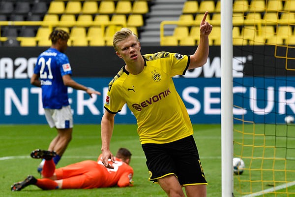 Dortmund's Erling Haaland celebrates Saturday after scoring the opening goal during the Bundesliga match between Borussia Dortmund and Schalke 04 in Dortmund, Germany.