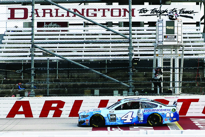 Kevin Harvick crosses the finish line to win the NASCAR Cup Series race Sunday at Darlington Raceway in Darlington, S.C.