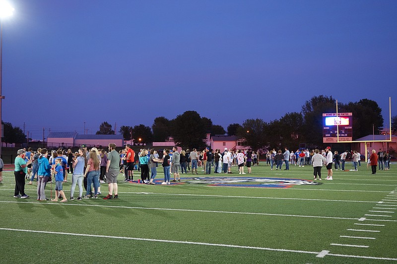 <p>Democrat photo/Paula Tredway</p><p>California High School seniors gather one last time in Riley Stadium while their senior pictures flash on the scoreboard.</p>