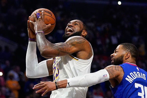 In this March 8 file photo, LeBron James of the Lakers goes up for a shot during a game against the Clippers in Los Angeles.