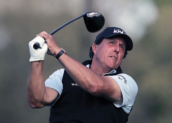 In this May 16, 2019, file photo, Phil Mickelson watches his tee shot during the first round of the PGA Championship at Bethpage Black in Farmingdale, N.Y. Mickelson is currently not in the field for this year's U.S. Open.