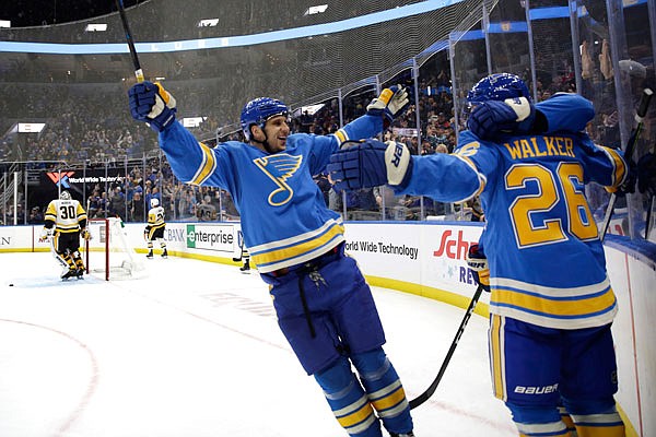 In this Nov. 30 2019, file photo, Nathan Walker is congratulated by Blues teammate Brayden Schenn (left) after scoring during a game against the Penguins in St. Louis.