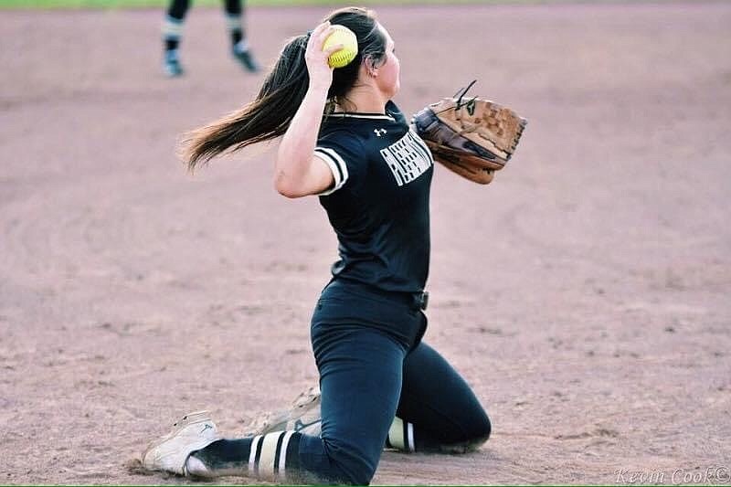 Pleasant Grove senior third baseman Presley Hargrove gets on her knees to make a throw to first base during a varsity softball game. (Submitted photo)