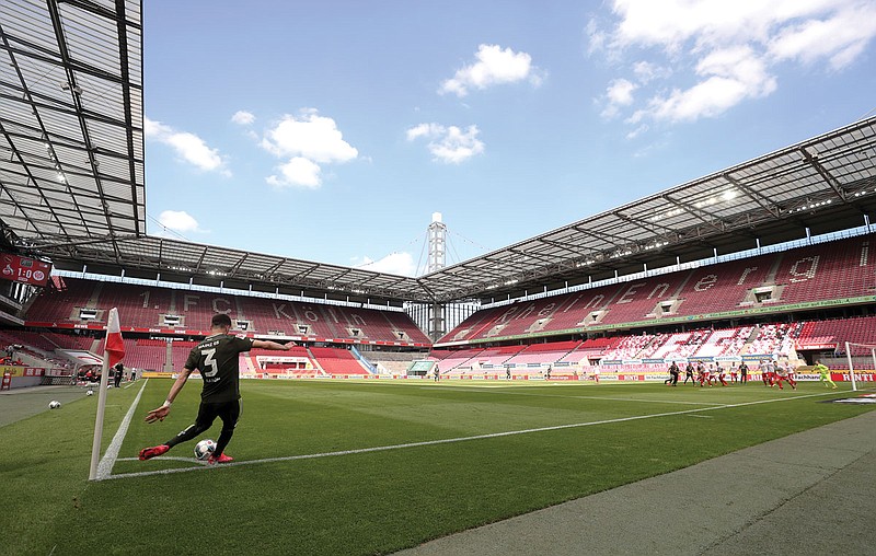 Aaron Martin of FSV Mainz 05 takes a corner kick during Sunday's Bundesliga soccer match against 1. FC Cologne in Cologne, Germany.