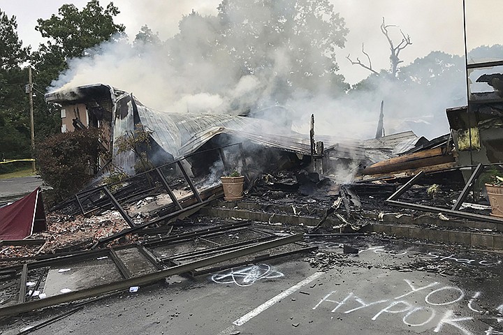 In this photo provided by the Marshall County Sheriff's Office embers smolder on the remains of the First Pentecostal Church in Holly Springs, Miss., Wednesday, May 20, 2020. Mississippi Gov. Tate Reeves on Thursday, May 21, 2020 condemned the church fire that's being investigated as an arson. The church burned about a month after it filed a lawsuit challenging city restrictions on gatherings amid the coronavirus pandemic. (Major Kelly McMillen/Marshall County Sheriff's Office via AP)
