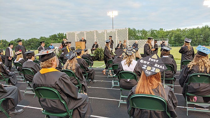 Some NCHS seniors decorated their caps with flowers, art, quotes, memes or topical references to the present situation. When crossing the stage, seniors skipped the traditional handshake with Principal Brian Jobe to avoid spreading germs.