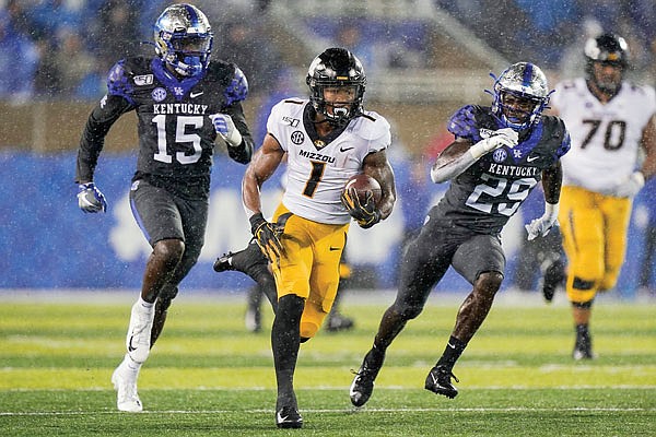 Missouri running back Tyler Badie carries the ball during a game last season against Kentucky in Lexington, Ky.