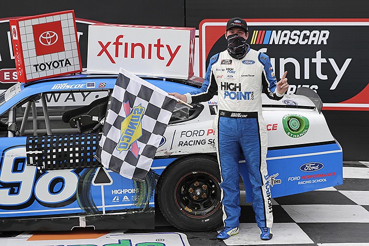 Chase Briscoe celebrates after winning the NASCAR Xfinity series auto race Thursday, May 21, 2020, in Darlington, S.C. (AP Photo/Brynn Anderson)