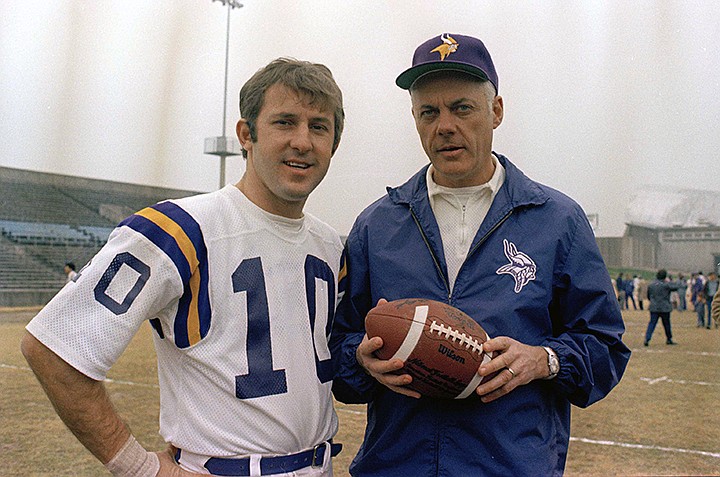  In this Jan. 7, 1974, file photo, Minnesota Vikings quarterback Fran Tarkenton (10) poses with coach Bud Grant in an unknown location. Grant was the first coach to reach four Super Bowls. Also the first to lose four Super Bowls. Grant built a powerhouse team over 18 seasons with the Vikings, reaching the playoffs 12 times. But his squads always flopped badly on the biggest stage, losing each of their four title games by double-digit margins. (AP Photo/Ferd Kaufman, File)