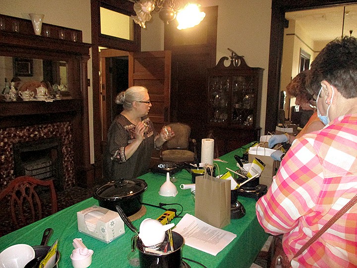 Texarkana Museums System curator Jamie Simmons leads a class on how to produce dandelion tea, skin balm and soap Saturday, May 23, 2020, during the museum's fourth annual Heritage Fair presentation inside the P.J. Ahern Home. More classes are being planned. Staff photo by Greg Bischof