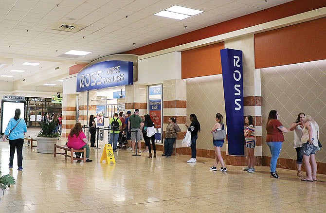 Shoppers socially distance Saturday while standing in line for Ross  Dress for Less at Capital Mall. The clothing store reopened Wednesday and has closed down all its entrances except this one to monitor the comings and goings of its customers to maintain a lower occupancy. 