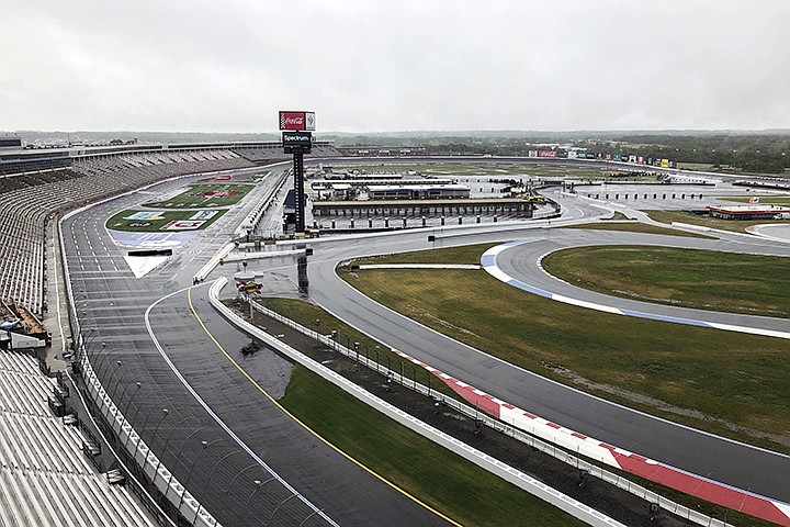 Charlotte Motor Speedway is shown in Concord, N.C., Wednesday, May 20, 2020. Some fans have been coming to the Coca-Cola 600 for decades, but they won't be allowed into Charlotte Motor Speedwa on Sunday due to Covid-19, leaving the grandstands empty and many disappointed. (AP Photo/Steve Reed)