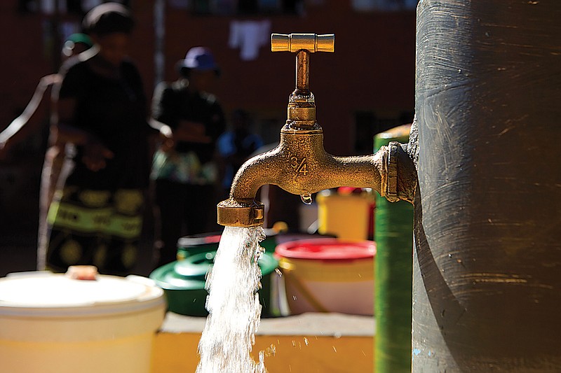 Water flows from a communal tap that the group Doctors Without Borders provided in a suburb of Harare, Zimbabwe. For people around the world who are affected by war and poverty, the simple act of washing hands is a luxury. In Zimbabwe, clean water is often saved for daily tasks like doing dishes and flushing toilets. 