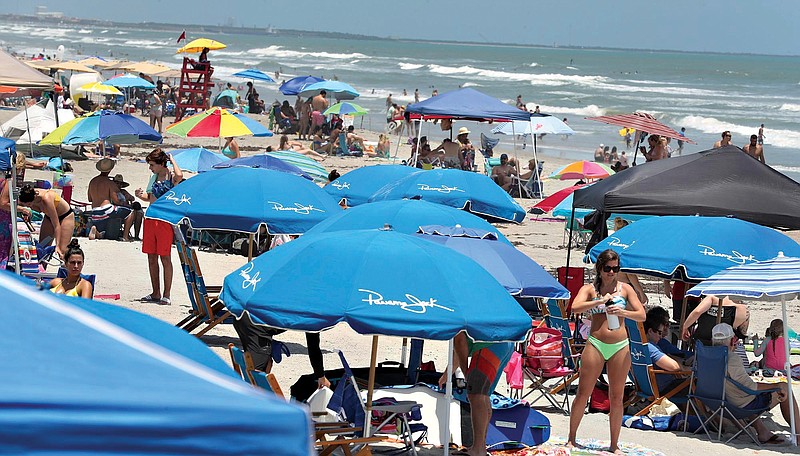 Cocoa Beach, Fla., is packed with Memorial Day beachgoers on Saturday. The beaches are open for business again during the coronavirus epidemic.    