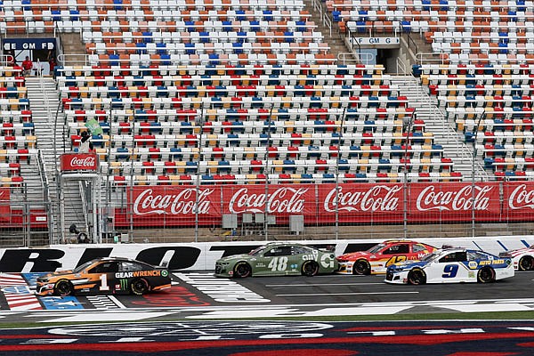 Kurt Busch leads the pack as the green flag is waved Sunday at the start of the NASCAR Cup Series race at Charlotte Motor Speedway in Concord, N.C.