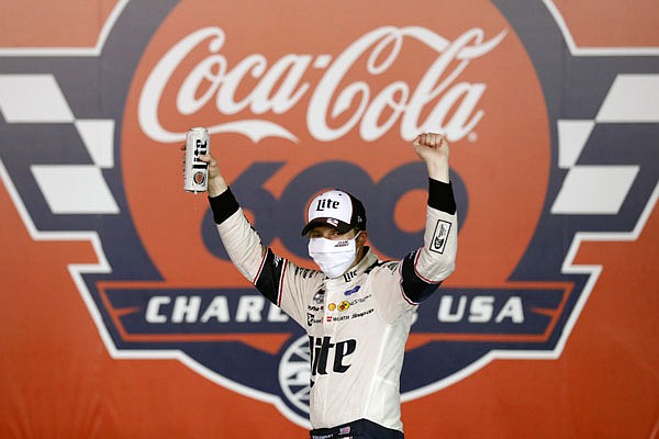 Brad Keselowski celebrates after winning the NASCAR Cup Series race at Charlotte Motor Speedway early Monday in Concord, N.C.