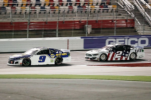 Chase Elliott leads Brad Keselowski during Sunday night's NASCAR Cup Series race at Charlotte Motor Speedway in Concord, N.C.