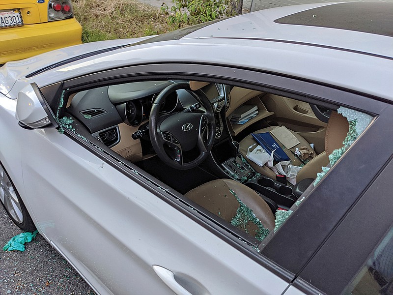 A parked car with a broken driver's side window is seen after a smash-and-grab break-in in Los Angeles. The coronavirus hasn't been kind to car owners. With more people than ever staying home to lessen the spread of COVID-19, their sedans, pickup trucks and SUVs are parked unattended on the streets, making them easy targets for opportunistic thieves.