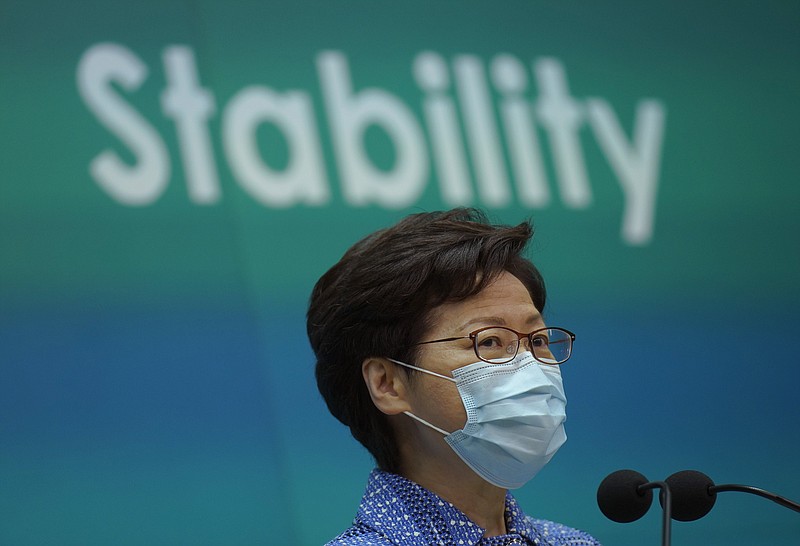 Hong Kong Chief Executive Carrie Lam listens to reporters' questions during a press conference in Hong Kong, Tuesday, May 26, 2020. Lam tried again Tuesday to defend a new national security law that China's parliament is going to impose on Hong Kong. (AP Photo/Vincent Yu)