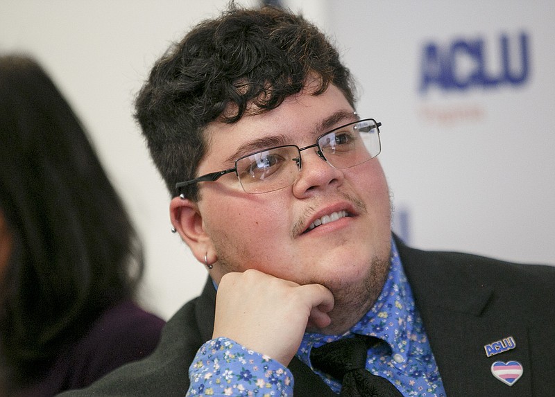 FILE - In this July 23, 2019, file photo, Gavin Grimm, who has become a national face for transgender students, speaks during a news conference held by The ACLU and the ACLU of Virginia at Slover Library in Norfolk, Va. A federal appeals court is hearing arguments Tuesday, May 26, 2020, in the case of Grimm who sued a Virginia school board after he was barred as a student from using the boys’ bathrooms at his high school. A judge ruled last year that the Gloucester County School Board had discriminated against Grimm. (Kristen Zeis/The Daily Press via AP, File)