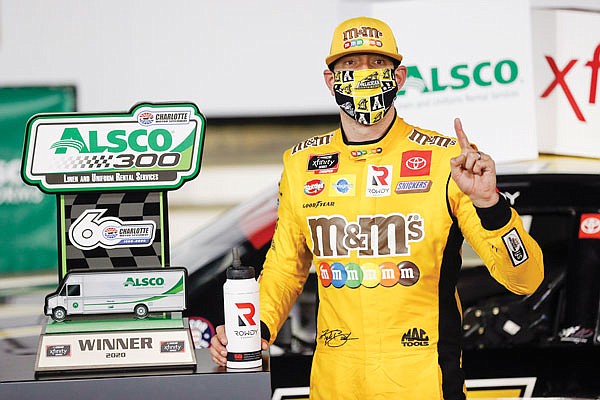 Kyle Busch celebrates Monday night after winning the NASCAR Xfinity Series race at Charlotte Motor Speedway in Concord, N.C.