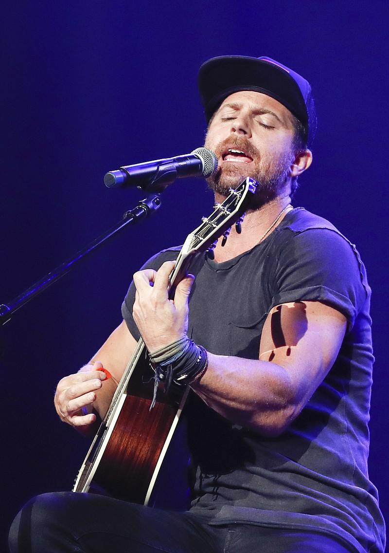 This Sept. 19, 2018 file photo shows Kip Moore performing at the 2018 Nashville Songwriters Awards in Nashville, Tenn. Moore was used to traveling the world to surf, rock climb or hike, but lately he's been isolating himself in a remote lodge in eastern Kentucky. The Georgia-born artist releases his new album "Wild World," in a very chaotic time, but he said his introspective messages might help people right now. (Photo by Al Wagner/Invision/AP, File)