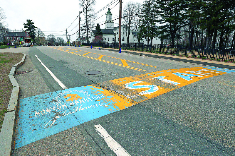 In this April 20 file photo, the Boston Marathon start line in Hopkinton, Mass., is vacant on the scheduled day of the 124th race due to the COVID-19 virus outbreak. The 2020 Boston Marathon, which was rescheduled to run Sept. 14, was canceled Thursday for the first time in its 124-year history.