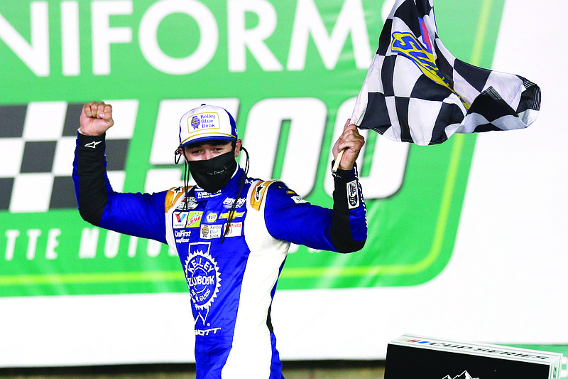 Chase Elliott celebrates after winning a NASCAR Cup Series race Thursday night at Charlotte Motor Speedway in Concord, N.C.