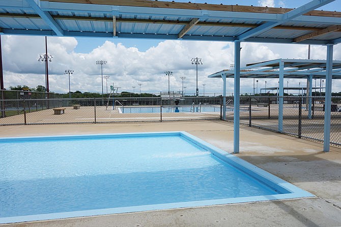 The water at Oestreich Swimming Complex will be ready for swimmers on June 5. Out front, decals reminding visitors to maintain social distancing dot the sidewalk.