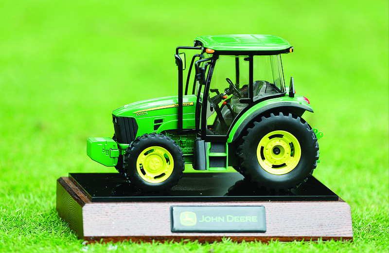 In this July 13, 2013, file photo, a John Deere tractor tee marker is seen during the third round of the John Deere Classic at TPC Deere Run in Silvis, Ill.