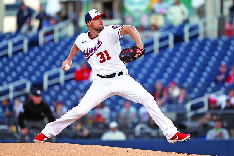 In this Feb. 27 file photo, Nationals pitcher Max Scherzer throws during the first inning of a spring training game against the Astros in West Palm Beach, Fla.