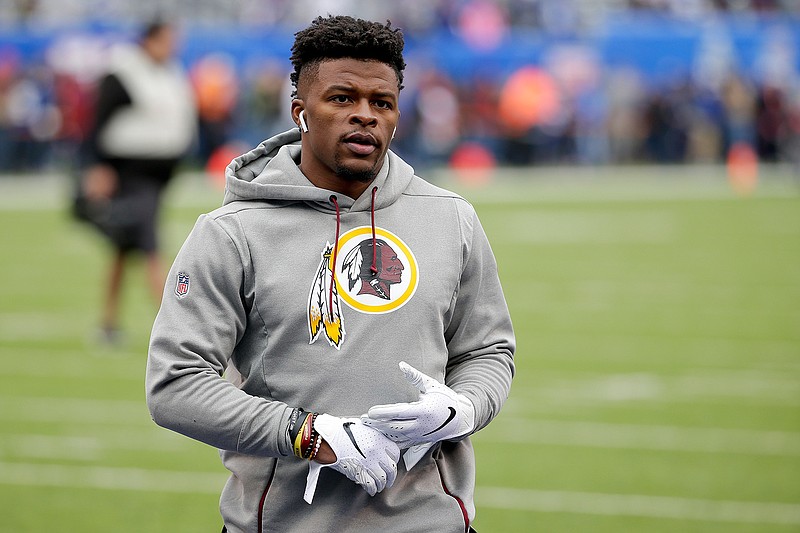 In this Oct. 28, 2018, file photo, then-Washington Redskins running back Chris Thompson (25) warms up before an NFL football game against the New York Giants in East Rutherford, N.J. Reporters from The Associated Press spoke to more than two dozen athletes from around the globe -- representing seven countries and 11 sports -- to get a sense of how concerned or confident they are about resuming competition. Thompson is an NFL running back. He's also the father of a 4-month-old daughter, Kali.  "If I go practice or play and I come back home with the virus, she's not strong enough yet to fight something like that. For me, that's my biggest worry," said Thompson, who signed with the Jacksonville Jaguars this month after seven seasons with the Redskins. (AP Photo/Seth Wenig, File)