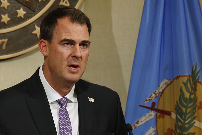 Oklahoma Gov. Kevin Stitt speaks during a news conference Wednesday, May 20, 2020, in Oklahoma City. Stitt said the state is launching an online portal for cities and counties to submit requests for reimbursement from federal funds for their coronavirus-related expenses. (AP Photo/Sue Ogrocki)