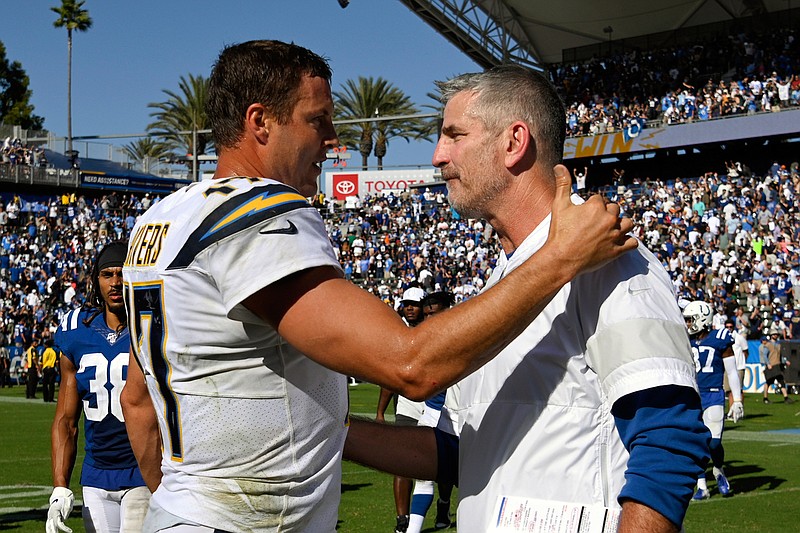 In this Sept. 8, 2019, file photo, Los Angeles Chargers quarterback Philip Rivers, left, greets Indianapolis Colts head coach Frank Reich after an NFL football game in Carson, Calif. The Indianapolis Colts bet big on 38-year-old Philip Rivers. They're hoping the $25 million investment in a new starting quarterback pays off with a playoff appearance and perhaps Super Bowl run. Colts coach Frank Reich insists he's seen no physical decline in the eight-time Pro Bowler. (AP Photo/Mark J. Terrill, File)