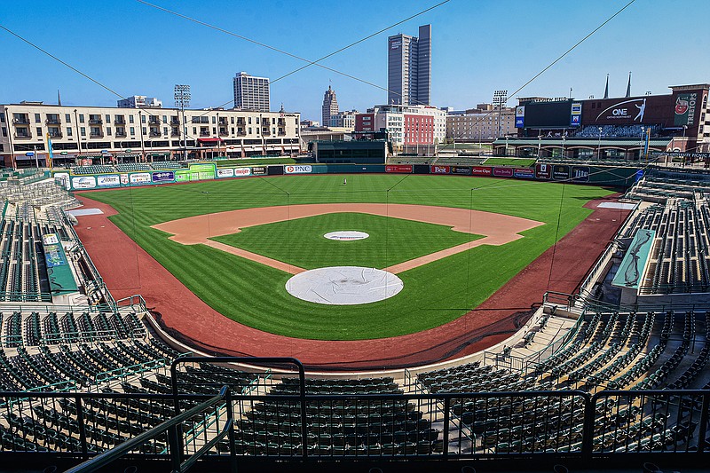 In this April 8, 2020, file photo, an empty Parkview Field minor league baseball stadium is viewed in downtown Fort Wayne, Ind. Minor league umpires are out of jobs so far and maybe all year with no minor league seasons due to the coronavirus pandemic. (Mike Moore/The Journal-Gazette via AP, File)