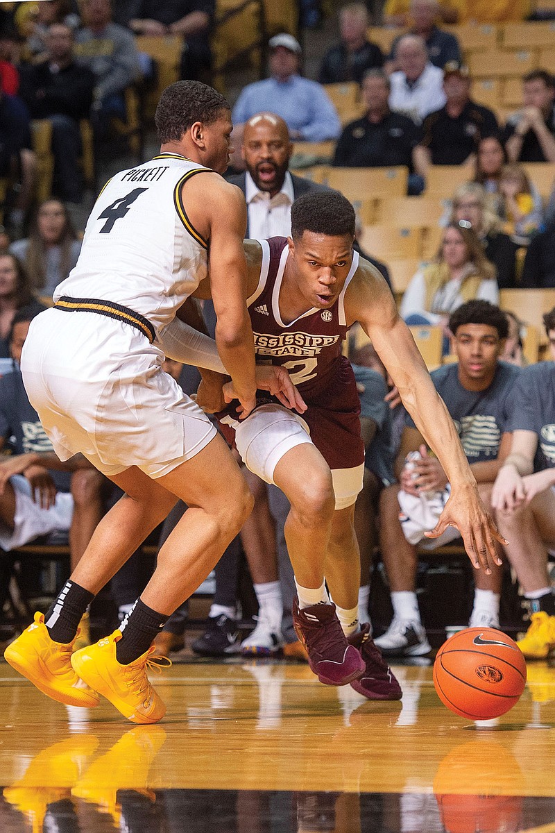 Mississippi State's Robert Woodard II (right) dribbles past Missouri's Javon Pickett during a Feb. 29 game at Mizzou Arena. The NCAA released a plan to assist schools in bringing athletes back to campus during the COVID-19 pandemic.