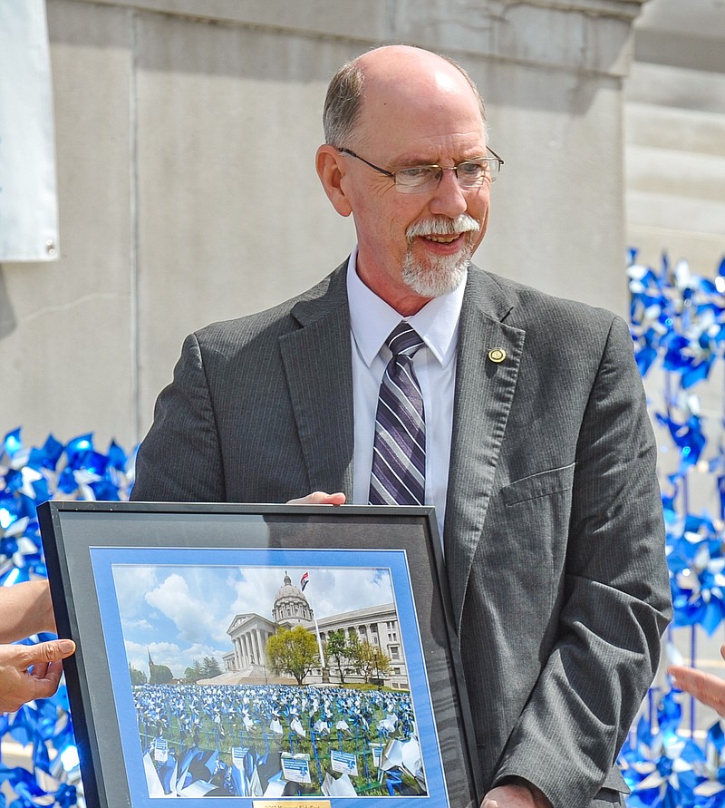 File Photo: Rep. David Wood addresses the crowd as he accepts the Standing for Children Award during the Pinwheels for Prevention Ceremony at the Capitol on April 13, 2017. Wood, who has termed out of the House of Representatives, has accepted the position of Director of Missouri Department of Social Services Children's Division