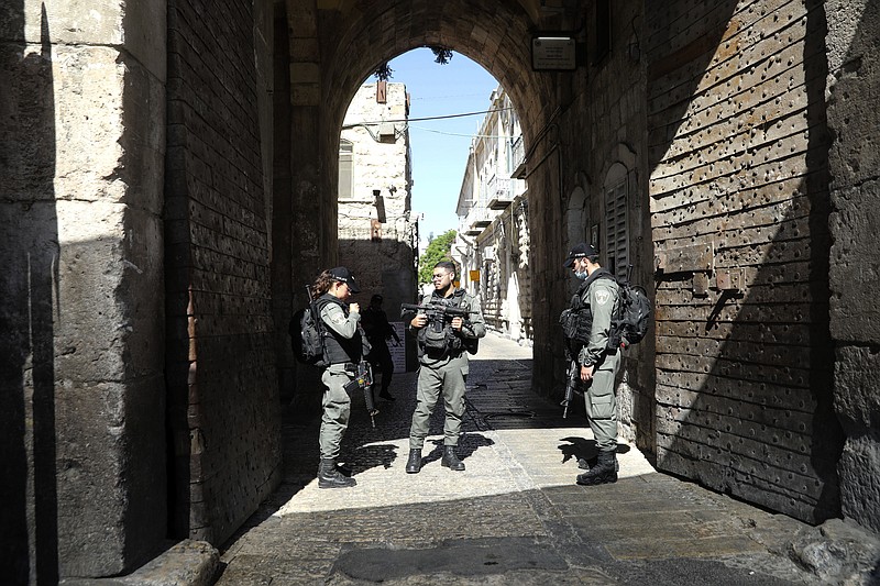 Israeli police officers secure the area of Lion's gate in Jerusalem's Old City, Saturday, May 30, 2020. Israeli police shot dead a Palestinian near Jerusalem's Old City who they had suspected was carrying a weapon but turned out to be unarmed. (AP Photo/Mahmoud Illean)