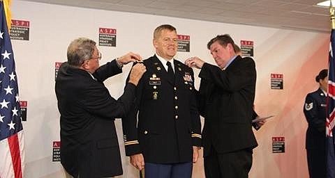 <p>Submitted</p><p>Col. Ned Holt’s father, Joe Holt, and younger brother, Dan Holt, pin on the new rank.</p>