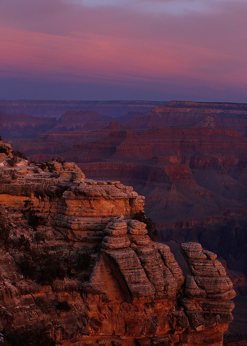 The colors of dawn begin to paint the age-old rock formations of the Grand Canyon along the South Rim near Mather Point on March 11, 2015. National Parks are taking a "phased approach" to reopening. (Mark Boster/Los Angeles Times/TNS)