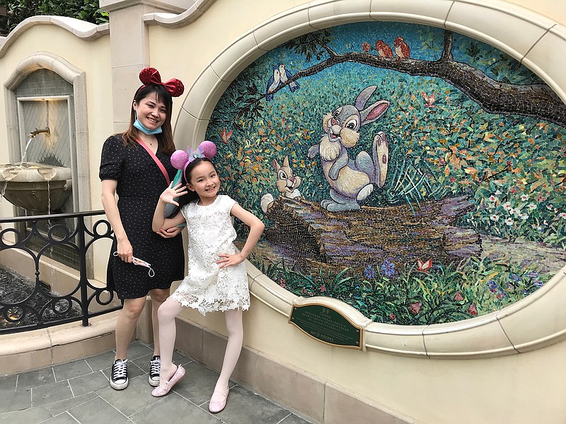 Liu Jiali, 39, and her daughter Margaret Liu, 8, were on a Disneyland trip before Margaret's long-awaited return to second grade. (Alice Su/Los Angeles Times/TNS)