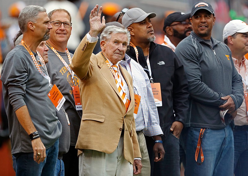 In this Oct. 12, 2019, file photo, former Tennessee head football coach Johnny Majors waves to fans as he and members of the 1998 football team are introduced in the first half of an NCAA college football game against Mississippi State, in Knoxville, Tenn. Majors, the coach of Pittsburgh's 1976 national championship team and a former coach and star player at Tennessee, has died. He was 85. Majors died Wednesday morning, June 3, 2020, at home in Knoxville, Tenn., according to a statement from his wife, Mary Lynn Majors. (AP Photo/Wade Payne, FIle)