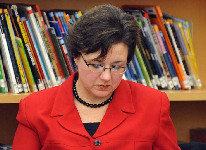 In this Feb. 14, 2012 News Tribune file photo, Lorie Winslow, who was then the elementary principal at Blair Oaks, reviews paperwork outside a school board meeting. Winslow was a principal at Linn middle and high school on May 18, 2020, when the Osage County R-2 Board of Education voted to immediately terminate her employment, according to a lawsuit petition submitted by her attorney.