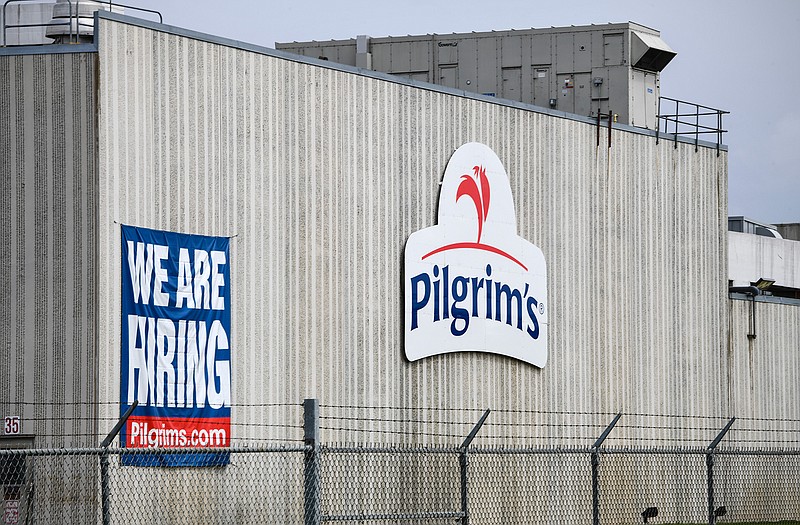 This April 28, 2020 file photo shows the Pilgrim's Pride plant in Cold Spring. Minn. A federal grand jury has charged four current and former chicken company executives with price-fixing. The U.S. Department of Justice says the executives from Colorado-based Pilgrim's Pride and Georgia-based Claxton Poulrty conspired to fix prices and rig bids for broiler chickens from at least 2012 to 2017.(Dave Schwarz/St. Cloud Times via AP)
