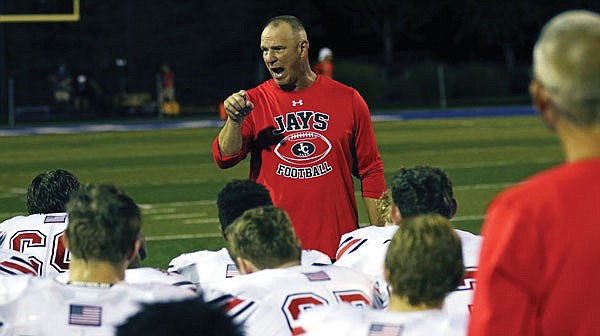 Jefferson City coach Terry Walker speaks to his team following a 2018 game against St. Louis University High in St. Louis. Walker turned in a letter of resignation Tuesday.
