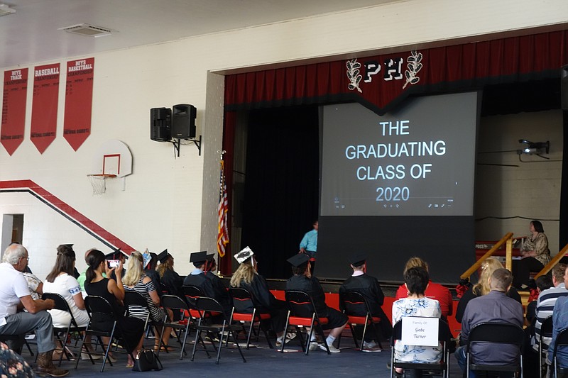 <p>Democrat photo/Paula Tredway</p><p>Graduation ended with a video showcasing pictures of each senior throughout the years while the song of their choice played.</p>
