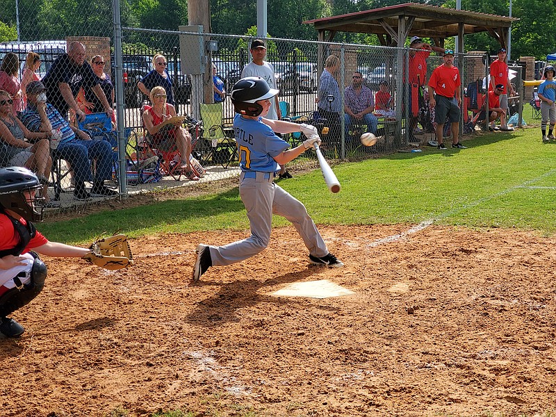 Chad Pirtle, a player on the 8-under Texarkana, Texas, Dixie League baseball team Pirates, gets a hit and drives in a run on Saturday, June 6, 2020, at Ed Worrell Memorial Park in Texarkana, Ark.