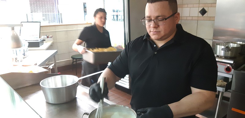 Edgar Ruvalcaba, manager of Los Ruvalcaba at Central Mall in Texarkana, Texas, prepares white queso dip for Thursday's lunch crowd. Los Ruvalcaba is a family-run Mexican eatery, whose original location on North State Line has been open for five years.
